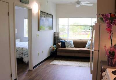 Interior view of a resident's room with couch and bed