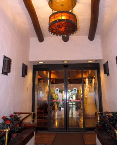 Entrance area with decorative lighting and flowers