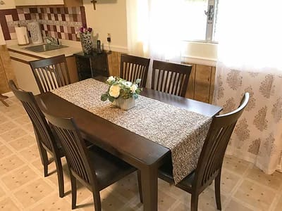 Interior dining area with a wooden table and chairs