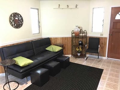 Cozy interior seating area with a black sofa and decor
