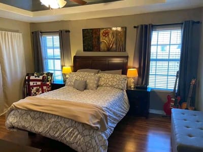 Cozy bedroom with a bed and warm lighting