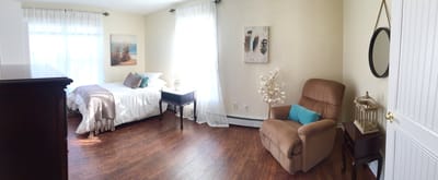 A cozy resident room with natural light