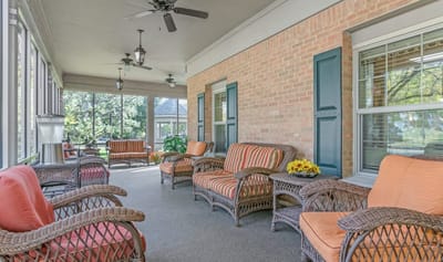 Bright common area with comfortable seating for residents