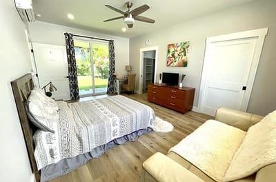 A cozy, well-furnished room with patio access