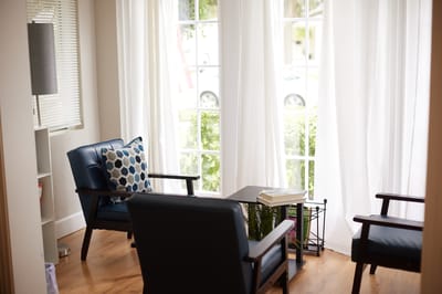 Cozy seating area with natural light and plants