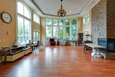 Bright common area with large windows and seating
