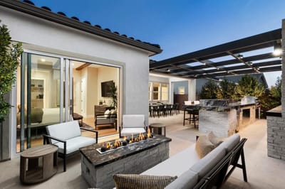 Outdoor patio area with seating and a fire pit