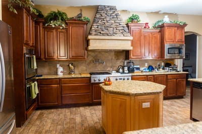 Interior kitchen with wooden cabinets and granite countertops