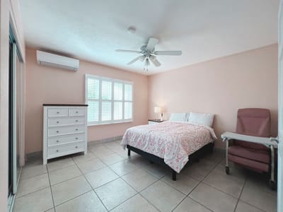 Private resident room with a bed and dresser