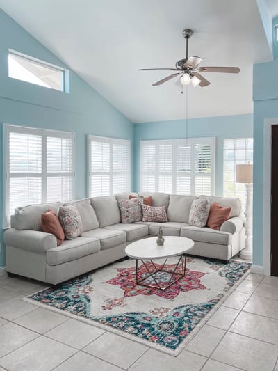Bright and cozy common area with sectional couch