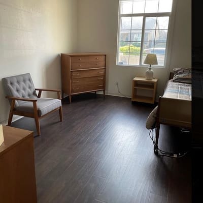 Bright, spacious resident room with furniture