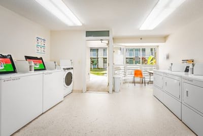 Laundry room with washers and dryers in a senior facility