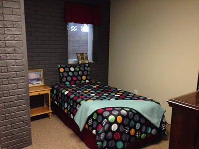 Cozy resident room with patterned bedding