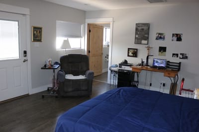 Cozy resident room with a chair and desk