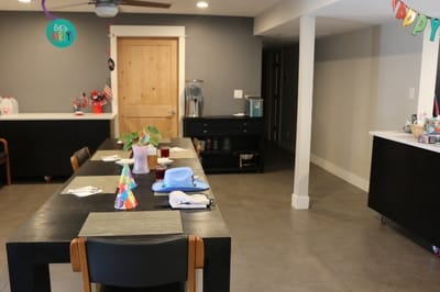 Dining area with festive decorations and tables set up