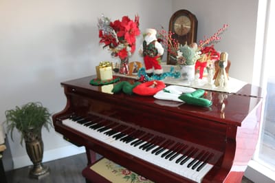 Decorated piano in a festive interior setting