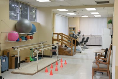Therapy room with exercise equipment and mats