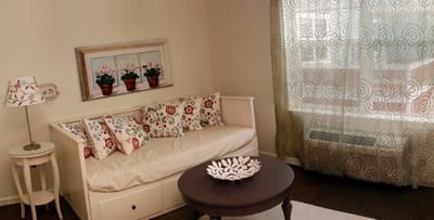 Cozy resident room with floral decor and natural light