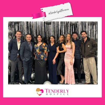Group of people posing at an event for Tenderly Hospice