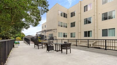 Outdoor seating area with tables and chairs