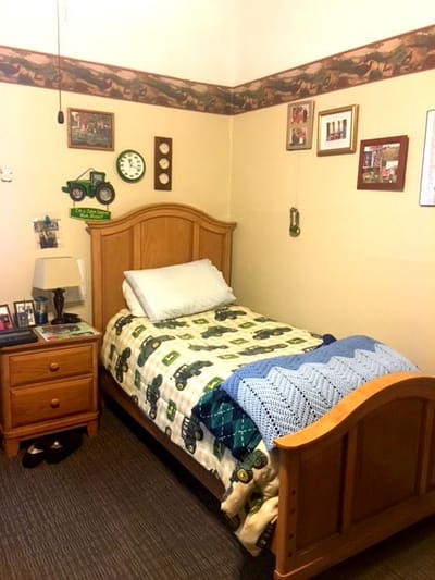 Cozy resident room with a bed and personal decor