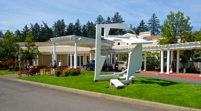 Exterior view of senior living facility with outdoor space