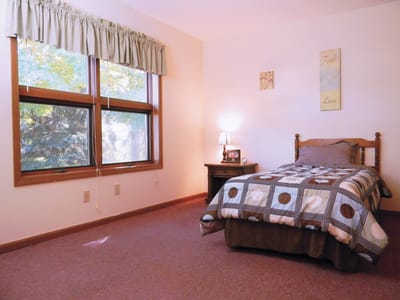 Cozy resident room with a bed and window
