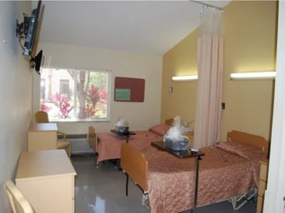 Shared resident room with beds and furnishings
