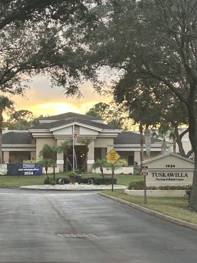 Exterior view of Tuskawilla Nursing and Rehab Center at sunset