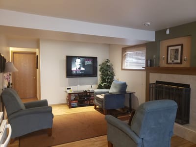 Interior common area with seating and a television