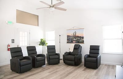 Bright common area with reclining chairs
