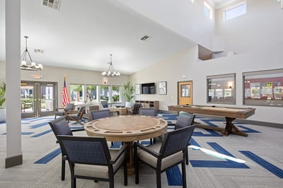 Bright common area with seating and tables