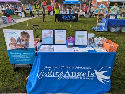 Event table for Visiting Angels with staff and information pamphlets