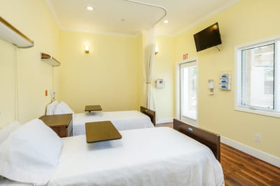 Bright, well-furnished resident room with two beds