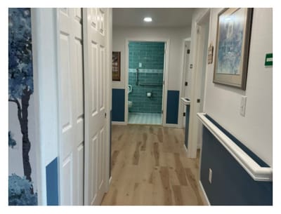 Interior hallway with doors leading to rooms