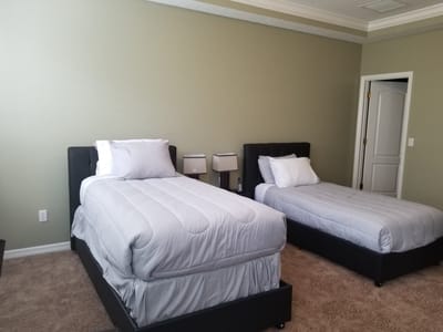 A bright, simple room with two twin beds