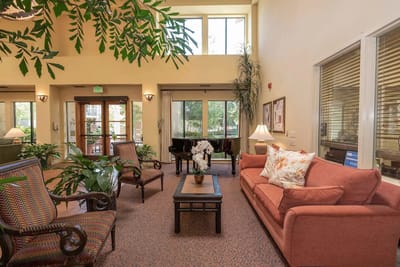 Bright common area with seating and plants