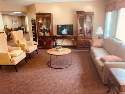 Interior common area with seating and a television