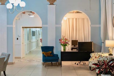Bright and inviting common area with seating and floral arrangements