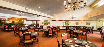 Dining room with tables set and chandelier lighting