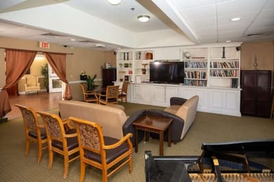 Interior common area with seating and bookshelves
