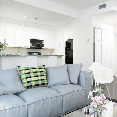 Bright, modern common area with a cozy sofa