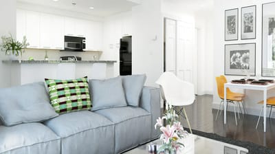 Bright interior view of a modern living room with kitchen