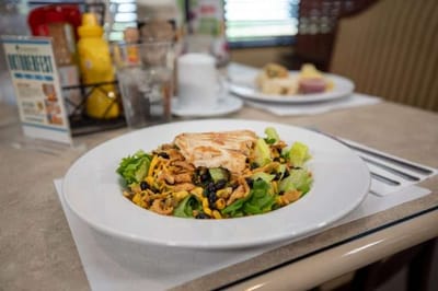 A vibrant salad served in a dining room