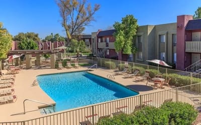 Outdoor pool area with lounge chairs