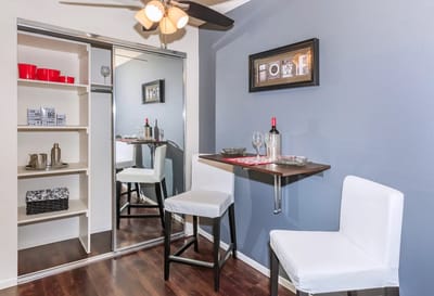 Modern apartment interior with bar seating and decor