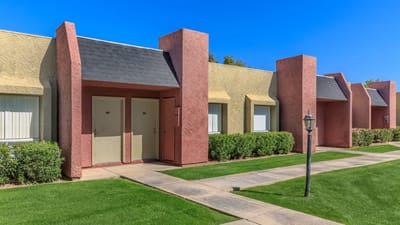 Exterior view of Eastridge Apartments with pathways and landscaping
