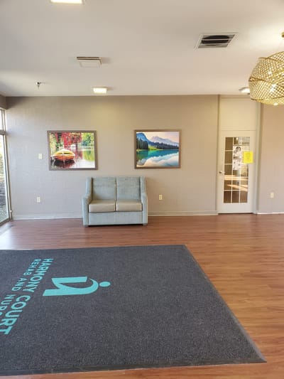 Bright interior of the facility lobby with artwork and seating