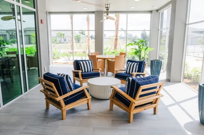 Bright indoor seating area with comfortable chairs