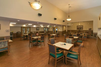Bright and spacious dining area with tables and chairs
